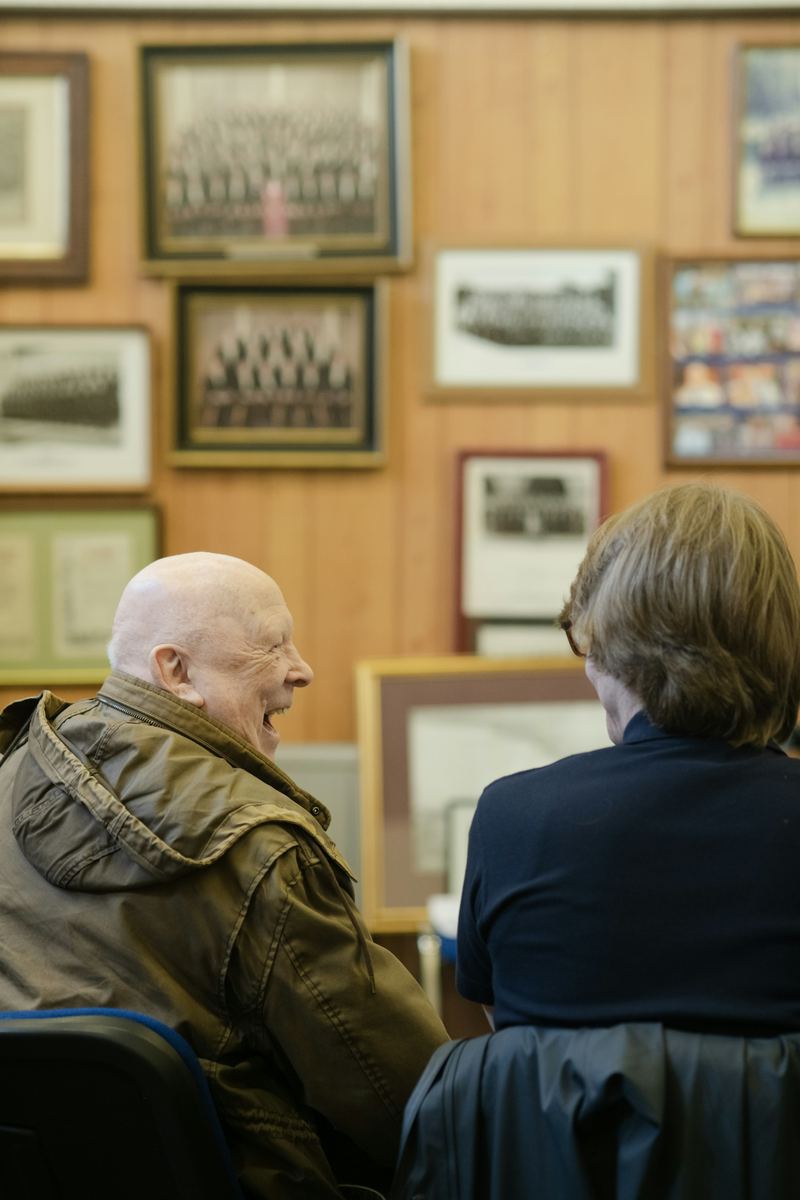 An older man laughing
